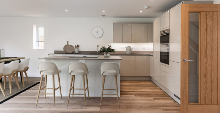 4 bedroom open plan kitchen breakfast area with high end gloss kitchen units and silestone worktops.